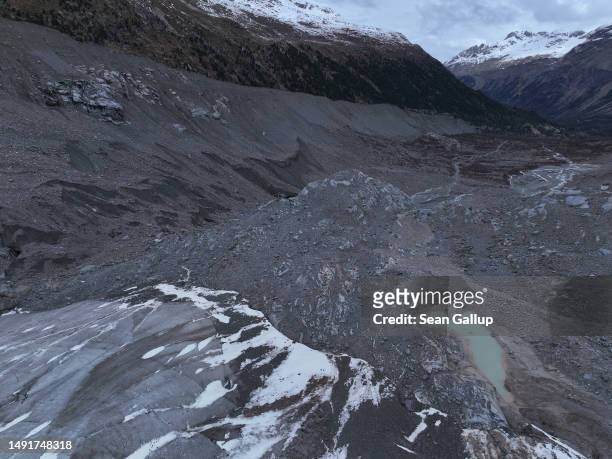 In this aerial view the receding Morteratsch glacier lies above a rocky basin it once filled completely on May 20, 2023 near Pontresina, Switzerland....