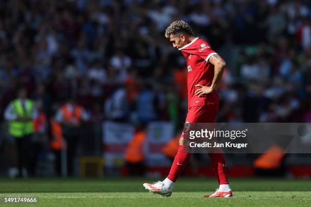 Roberto Firmino of Liverpool reacts after his final home appearance in the Premier League match between Liverpool FC and Aston Villa at Anfield on...