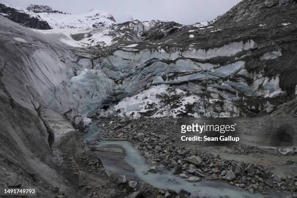 Small river of meltwater flows from a collapsed portion of the receding Morteratsch glacier on May 20, 2023 near Pontresina, Switzerland. On June 18...
