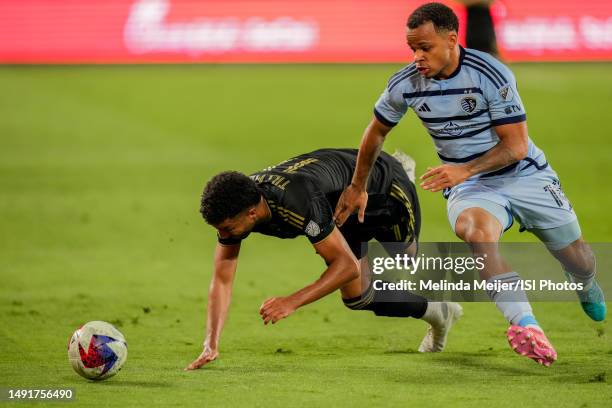 Timothy Tillman of Los Angeles FC has the ball taken by Logan Ndenbe of Sporting Kansas City at BMO Stadium on May 17, 2023 in Los Angeles,...