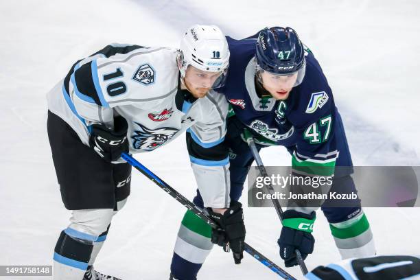 Evan Friesen of the Winnipeg Ice and Lucas Ciona of the Seattle Thunderbirds prepare for a second period face-off in Game Two of the 2023 WHL...