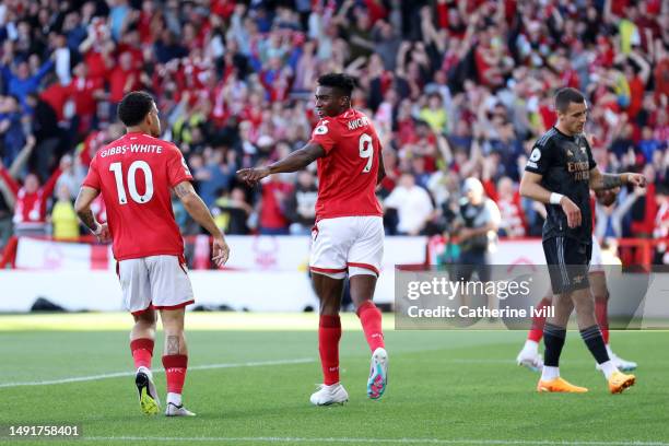 Taiwo Awoniyi celebrates with Morgan Gibbs-White of Nottingham Forest after scoring the team's first goal during the Premier League match between...