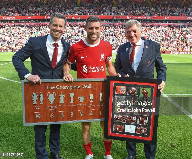 James Milner of Liverpool with Billy Hogan C.E.O. And Sir Kenny Dalglish at the end of the Premier League match between Liverpool FC and Aston Villa...
