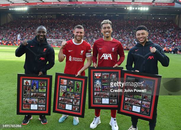 Naby Keita, James Milner, Roberto Firmino and Alex Oxlade-Chamberlain of Liverpool at the end of the Premier League match between Liverpool FC and...