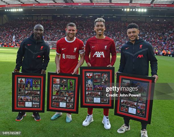 Naby Keita, James Milner, Roberto Firmino and Alex Oxlade-Chamberlain of Liverpool at the end of the Premier League match between Liverpool FC and...