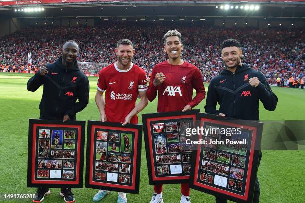 Naby Keita, James Milner, Roberto Firmino and Alex Oxlade-Chamberlain of Liverpool at the end of the Premier League match between Liverpool FC and...