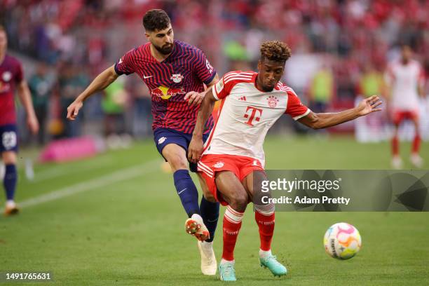 Josko Gvardiol of RB Leipzig and Kingsley Coman of FC Bayern Munich battle for the ball during the Bundesliga match between FC Bayern München and RB...