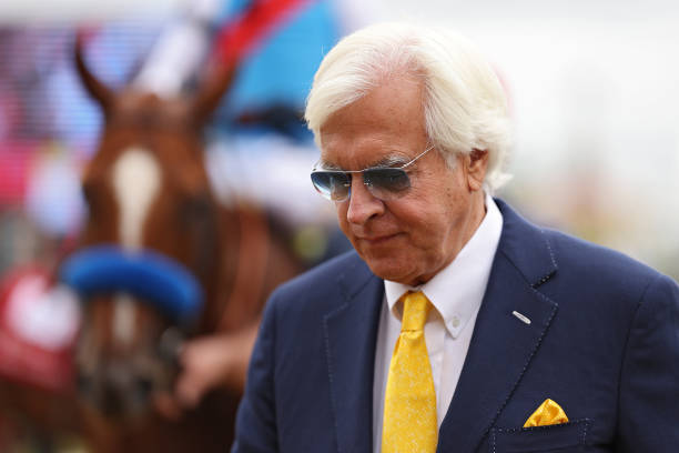 Trainer Bob Baffert looks on after winning The Sir Barton Stakes with jockey John Velazquez and horse Arabian Lion ahead of the 148th Running of the...