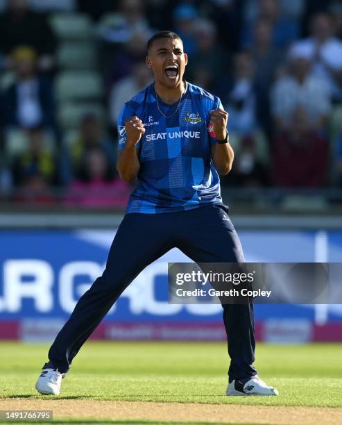 Ben Mike of Yorkshire celebrates dismissing Rob Yates of Warwickshire during the Vitality Blast T20 match between Birmingham Bears and Yorkshire...