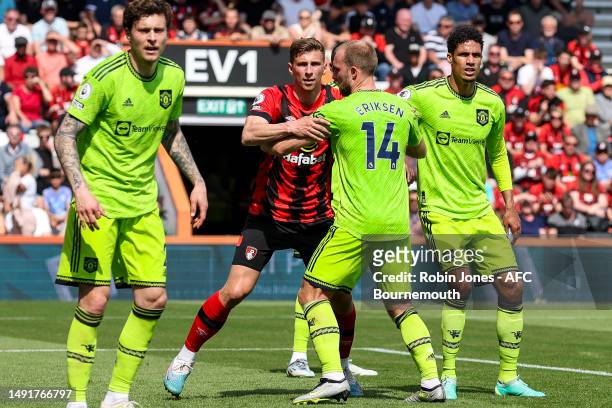 Illia Zabarnyi of Bournemouth and Christian Eriksen of Manchester United get to grips with each other at a corner during the Premier League match...