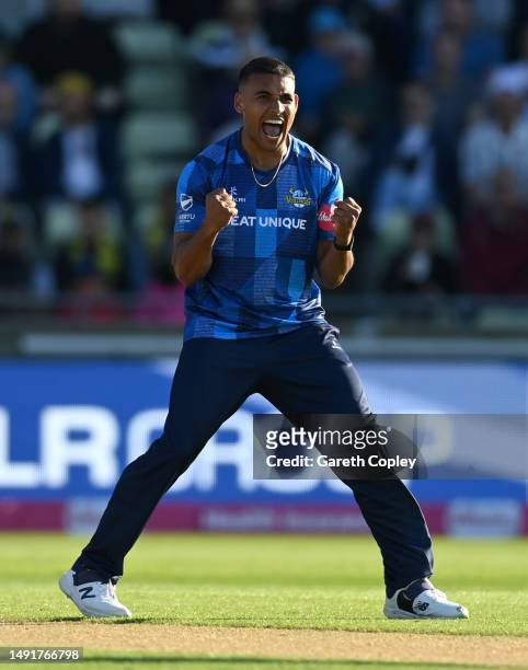 Ben Mike of Yorkshire celebrates dismissing Rob Yates of Warwickshire during the Vitality Blast T20 match between Birmingham Bears and Yorkshire...