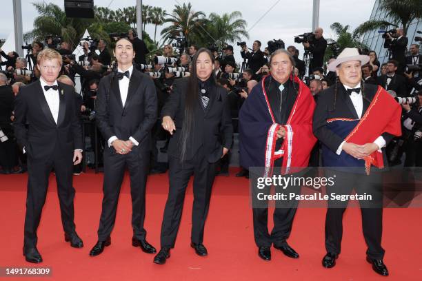 Jesse Plemons, Tatanka Means, William Belleau, guest, and guest, attend the "Killers Of The Flower Moon" red carpet during the 76th annual Cannes...