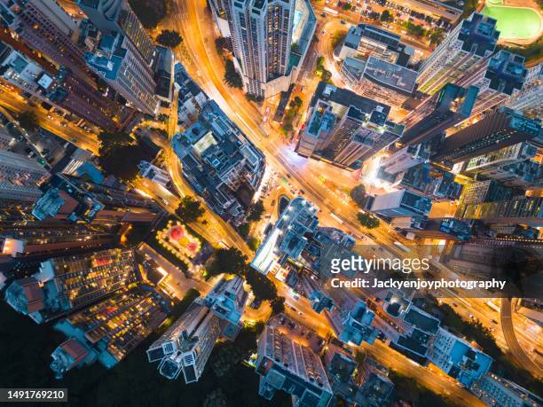 beautiful nighttime overhead picture of hong kong's overcrowded streets. - newly industrialized country stock pictures, royalty-free photos & images
