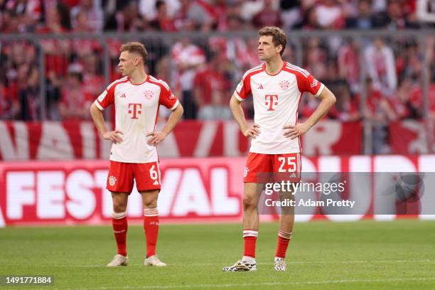 Joshua Kimmich and Thomas Mueller of FC Bayern Munich look dejected during the Bundesliga match between FC Bayern München and RB Leipzig at Allianz...