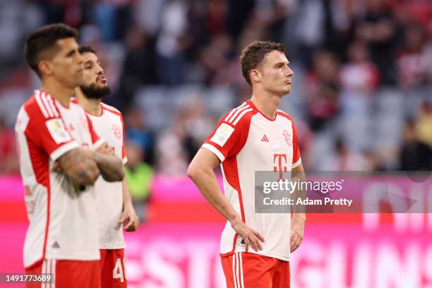 Benjamin Pavard of FC Bayern Munich looks dejected after the team's defeat in the Bundesliga match between FC Bayern München and RB Leipzig at...