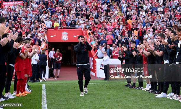 Alex Oxlade-Chamberlain of Liverpool given a guard of honour at the end of the Premier League match between Liverpool FC and Aston Villa at Anfield...