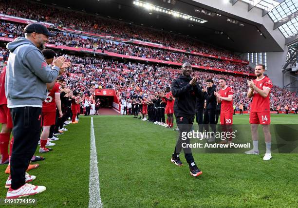 Naby Keita of Liverpool given a guard of honour at the end of the Premier League match between Liverpool FC and Aston Villa at Anfield on May 20,...
