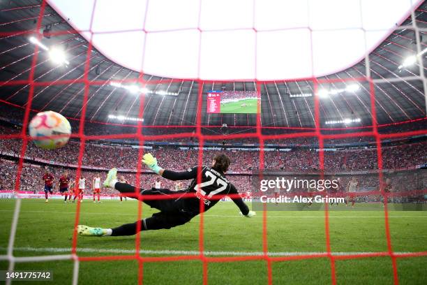 Yann Sommer of FC Bayern Munich fails to save a penalty kick from Christopher Nkunku of RB Leipzig as they score the team's second goal during the...