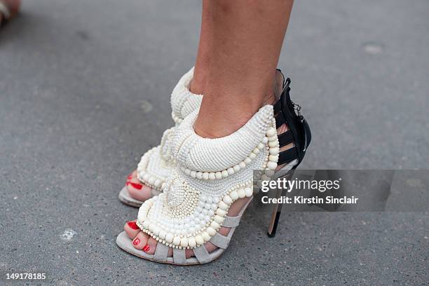 Paris, FRANCEAnna Dello Russo fashion editor at large for Vogue Japan wearing Kanye West by Giuseppe Zanotti shoes at Paris Fashion Week...