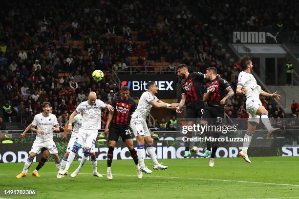 Olivier Giroud of AC Milan scores the team's second goal during the Serie A match between AC MIlan and UC Sampdoria at Stadio Giuseppe Meazza on May...