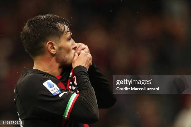 Brahim Diaz of AC Milan kisses the AC Milan badge as they celebrate after scoring the team's fourth goal during the Serie A match between AC MIlan...