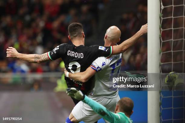 Olivier Giroud of AC Milan scores the team's fifth goal, his third goal of the match and hat-trick goal, whilst under pressure from Bram Nuytinck of...