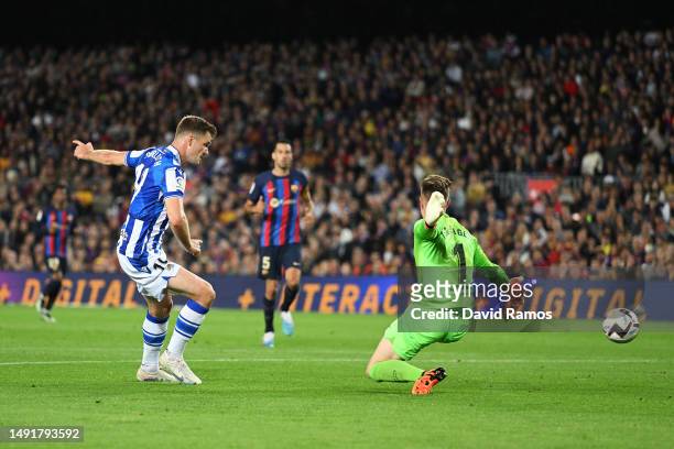 Alexander Sorloth of Real Sociedad scores the team's second goal as Marc-Andre ter Stegen of FC Barcelona fails to make a save during the LaLiga...