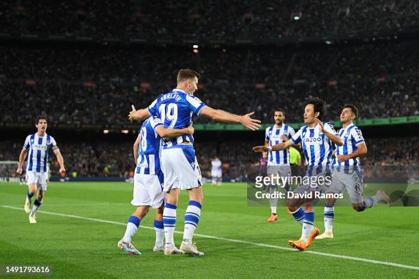 Alexander Sorloth of Real Sociedad celebrates with teammates after scoring the team's second goal during the LaLiga Santander match between FC...