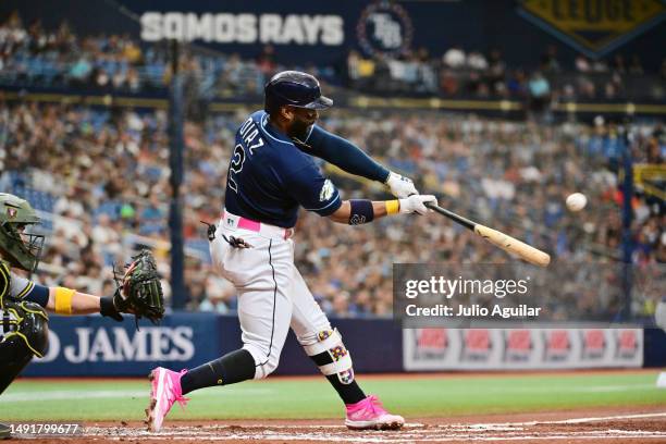 Yandy Diaz of the Tampa Bay Rays hits a 3-run home run in the second inning against the Milwaukee Brewers at Tropicana Field on May 20, 2023 in St...