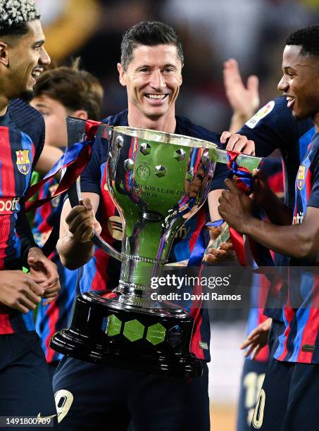 Robert Lewandowski of FC Barcelona celebrates with Laliga Trophy after the LaLiga Santander match between FC Barcelona and Real Sociedad at Spotify...