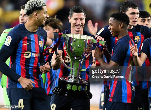 Robert Lewandowski of FC Barcelona celebrates with Laliga Trophy after the LaLiga Santander match between FC Barcelona and Real Sociedad at Spotify...