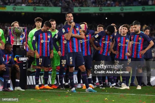 Sergio Busquets of FC Barcelona speaks to the fans as players of FC Barcelona celebrate after being crowned League Champiosn after the LaLiga...