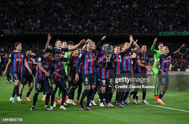 Barcelona players celebrate with LaLiga trophy after the LaLiga Santander match between FC Barcelona and Real Sociedad at Spotify Camp Nou on May 20,...