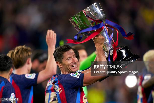 Robert Lewandowski of FC Barcelona celebrates with Laliga Trophy after the LaLiga Santander match between FC Barcelona and Real Sociedad at Spotify...