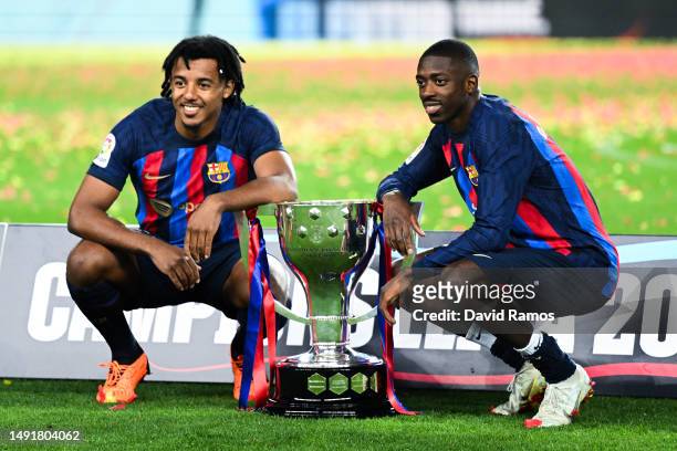 Jules Kounde and Ousmane Dembele of FC Barcelona pose with the LaLiga trophy after the LaLiga Santander match between FC Barcelona and Real Sociedad...