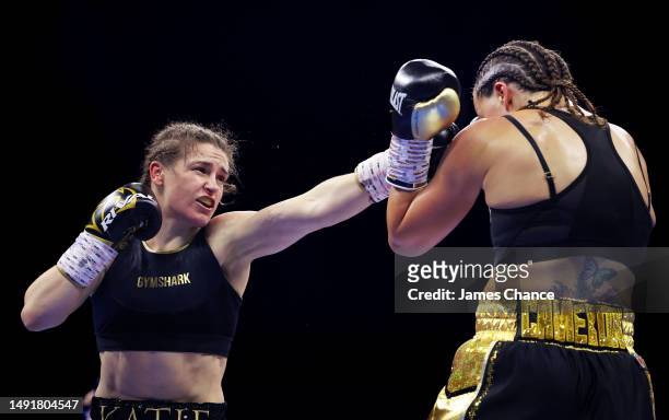 Katie Taylor punches Chantelle Cameron during the IBF, IBO, WBA, WBC and WBO World Super Lightweight Title fight between Katie Taylor and Chantelle...