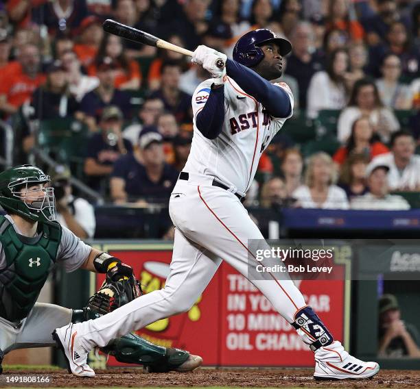 Yordan Alvarez of the Houston Astros hits a solo home run in the eighth inning against the Oakland Athletics at Minute Maid Park on May 20, 2023 in...