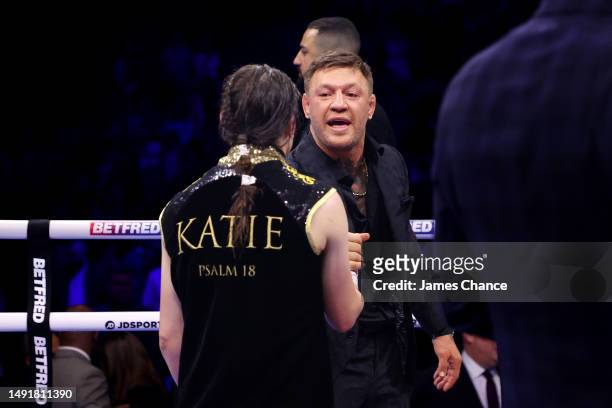 Katie Taylor interacts with Conor McGregor following defeat to Chantelle Cameron during the IBF, IBO, WBA, WBC and WBO World Super Lightweight Title...