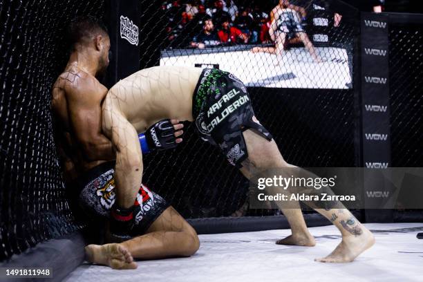 Rafael "Leprechaun" Calderon and Ubay Gonzalez fight during the Mixed Martial Arts competition "WOW 9 Mixed Martial Arts Competition" at Palacio...