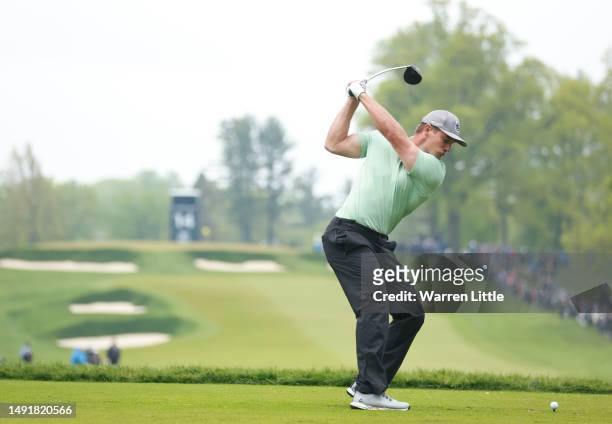 Bryson DeChambeau of the United States plays his shot from the 14th tee during the third round of the 2023 PGA Championship at Oak Hill Country Club...