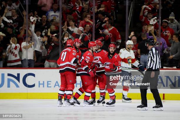 Jalen Chatfield of the Carolina Hurricanes celebrates with his teammates after scoring a goal on Sergei Bobrovsky of the Florida Panthers during the...