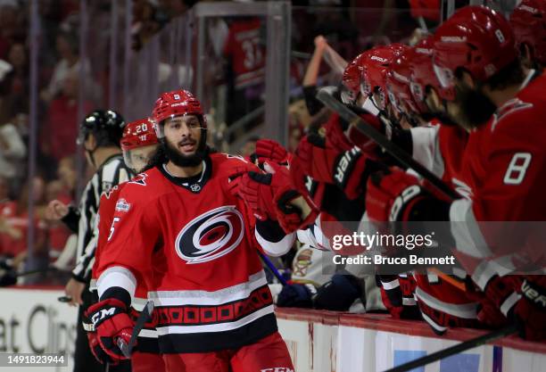 Jalen Chatfield of the Carolina Hurricanes celebrates with his teammates after scoring a goal on Sergei Bobrovsky of the Florida Panthers during the...