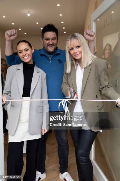 Mia Fevola, Brendan Fevola and Alex Fevola cut the ribbon to officially open the Runway Room Flagship on May 21, 2023 in Melbourne, Australia.