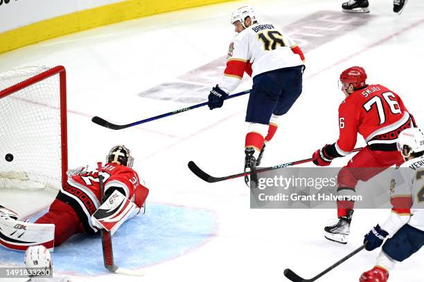 Aleksander Barkov of the Florida Panthers scores a goal on Antti Raanta of the Carolina Hurricanes during the second period in Game Two of the...