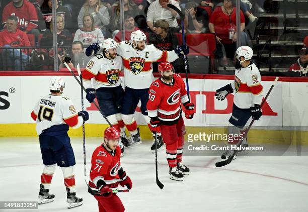 Aleksander Barkov of the Florida Panthers celebrates with his teammates after scoring a goal on Antti Raanta of the Carolina Hurricanes during the...
