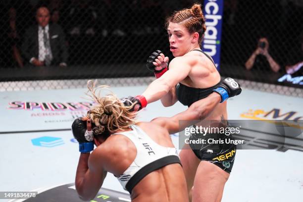 Mackenzie Dern punches Angela Hill in a strawweight fight during the UFC Fight Night event at UFC APEX on May 20, 2023 in Las Vegas, Nevada.