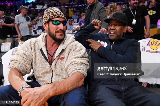 Denzel Washington and Dodd Romero attend game three of the Western Conference Finals between the Los Angeles Lakers and the Denver Nuggets at...