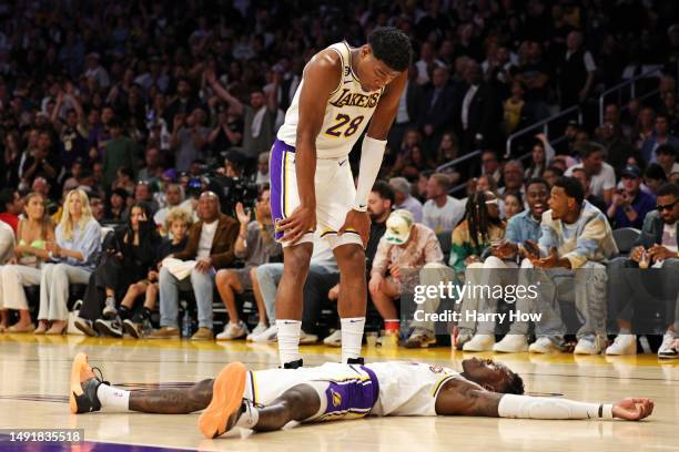 Dennis Schroder of the Los Angeles Lakers and Rui Hachimura of the Los Angeles Lakers react after a foul during the second quarter against the Denver...