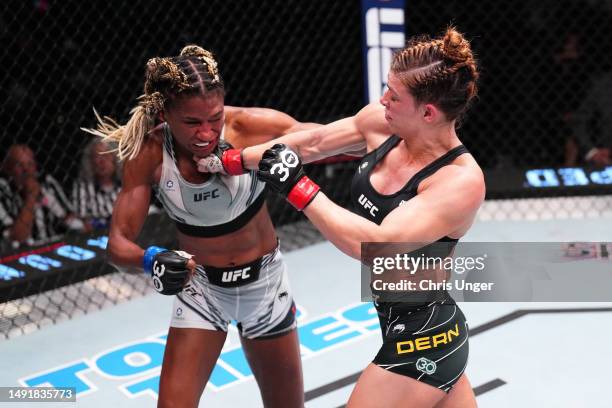 Mackenzie Dern punches Angela Hill in a strawweight fight during the UFC Fight Night event at UFC APEX on May 20, 2023 in Las Vegas, Nevada.