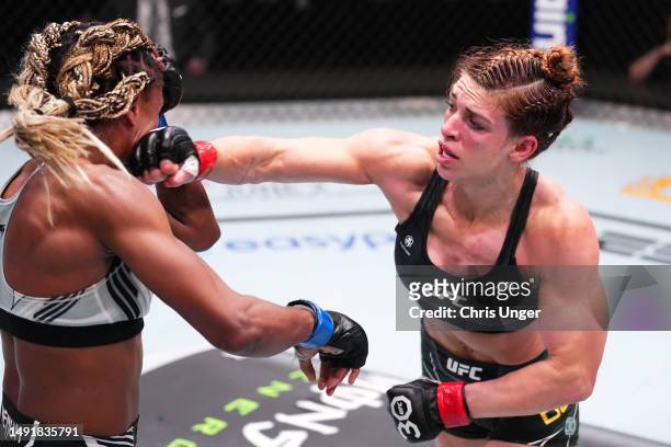 Mackenzie Dern punches Angela Hill in a strawweight fight during the UFC Fight Night event at UFC APEX on May 20, 2023 in Las Vegas, Nevada.